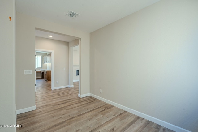 unfurnished room with light hardwood / wood-style floors