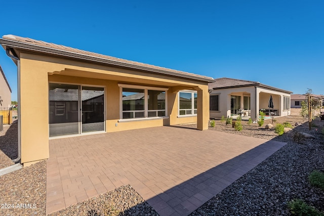 rear view of property with a patio