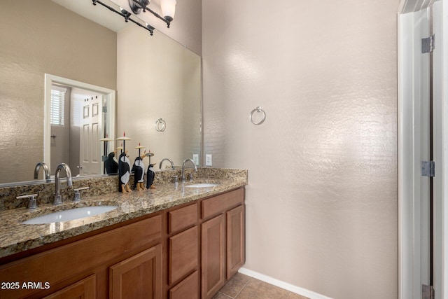 bathroom featuring tile patterned flooring and vanity