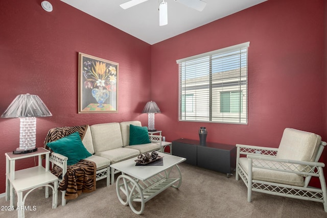 living room with ceiling fan and carpet floors