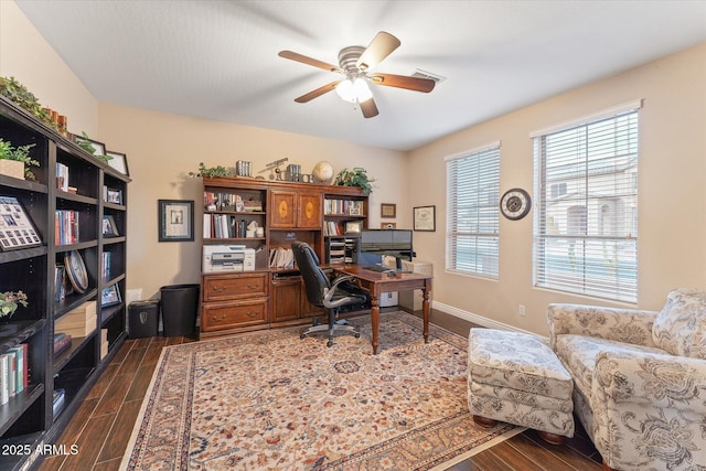 office featuring wood finish floors, baseboards, and a ceiling fan