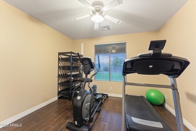 workout area featuring visible vents, baseboards, and wood tiled floor