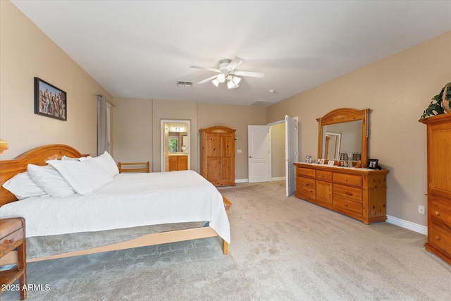 bedroom featuring visible vents, connected bathroom, baseboards, light colored carpet, and ceiling fan