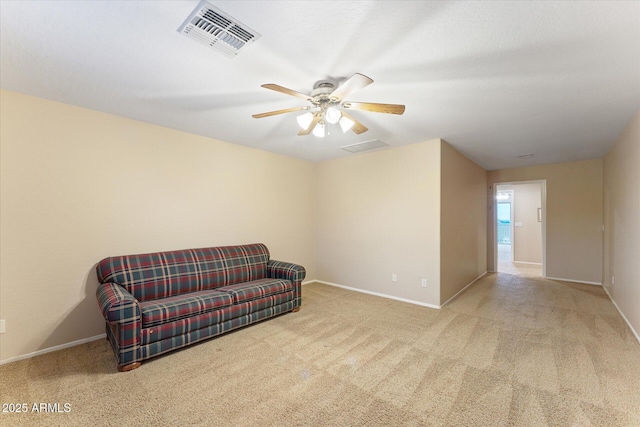 sitting room featuring ceiling fan, carpet, visible vents, and baseboards