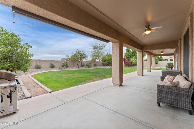 view of patio with a fenced backyard and ceiling fan