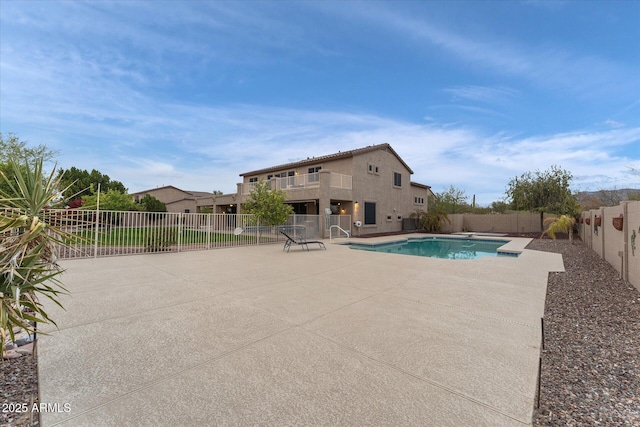 view of swimming pool featuring a patio, a fenced backyard, and a fenced in pool