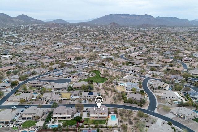 birds eye view of property with a mountain view and a residential view