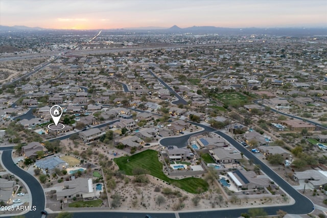 aerial view at dusk with a residential view