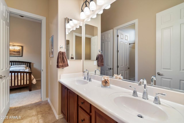 bathroom with tile patterned flooring and vanity