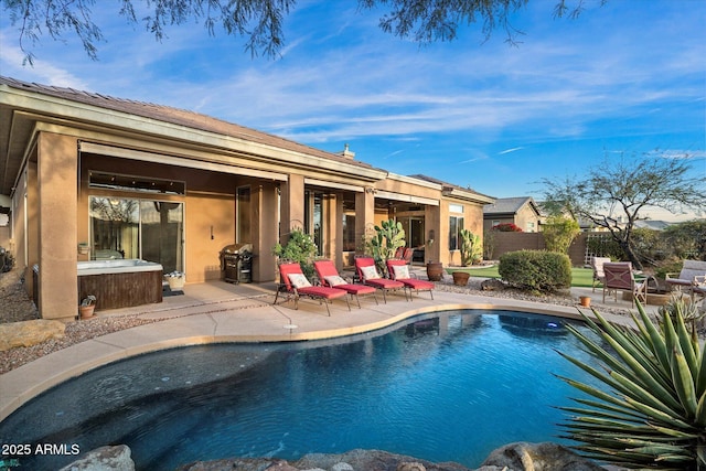 view of pool featuring grilling area and a patio area