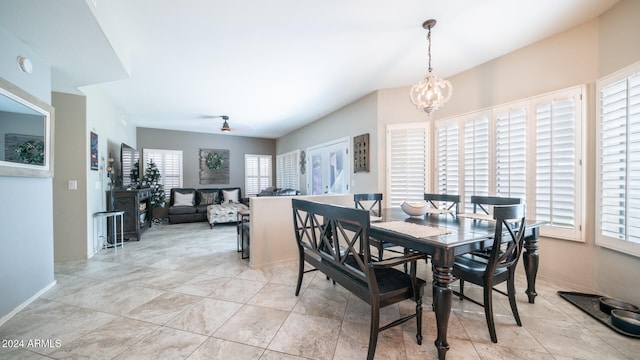 dining space featuring a chandelier