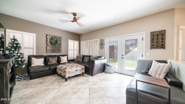 living room with french doors, light tile patterned floors, a wealth of natural light, and ceiling fan