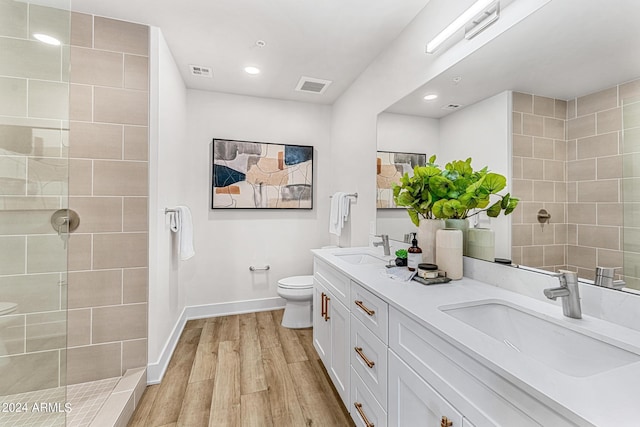 3131 N Central Ave Unit 6017, Phoenix, AZ 85012 - full bath with double vanity, wood finished floors, walk in shower, and recessed lighting