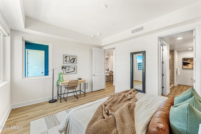 3131 N Central Ave Unit 6017, Phoenix, AZ 85012 - bedroom featuring light wood-type flooring and baseboards