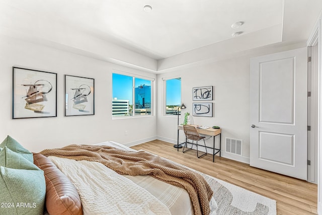 3131 N Central Ave Unit 6017, Phoenix, AZ 85012 - bedroom featuring wood finished floors and baseboards