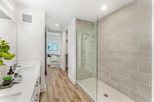 3131 N Central Ave Unit 6017, Phoenix, AZ 85012 - ensuite bathroom with wood finished floors, double vanity, a walk in shower, and recessed lighting