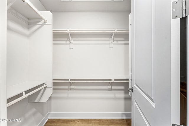 3131 N Central Ave Unit 6017, Phoenix, AZ 85012 - spacious closet with wood finished floors