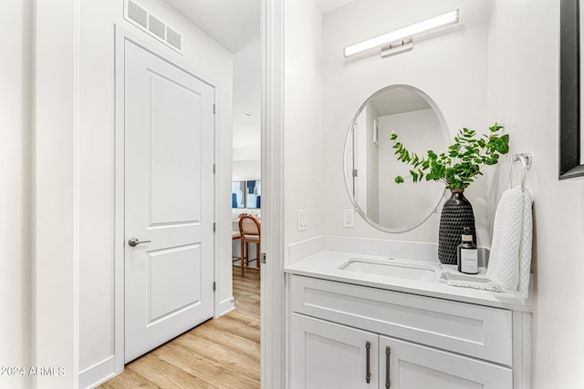 3131 N Central Ave Unit 6017, Phoenix, AZ 85012 - bathroom featuring wood finished floors and vanity