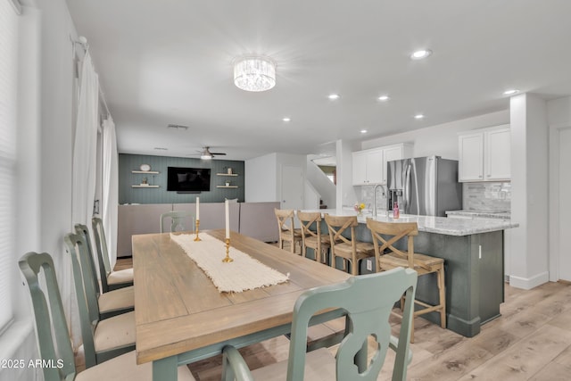 dining space with light wood finished floors, ceiling fan, visible vents, and recessed lighting