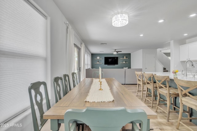 dining area with recessed lighting, stairway, and ceiling fan with notable chandelier