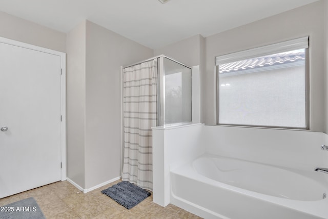 full bathroom with a garden tub, baseboards, and curtained shower