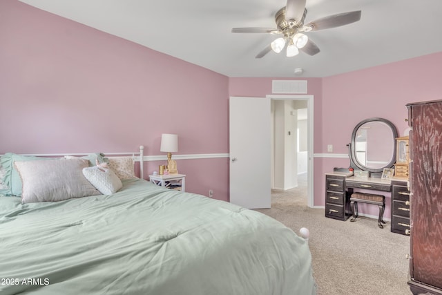 bedroom with baseboards, carpet, visible vents, and a ceiling fan