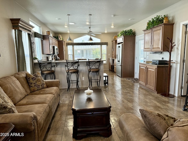 living room with ceiling fan