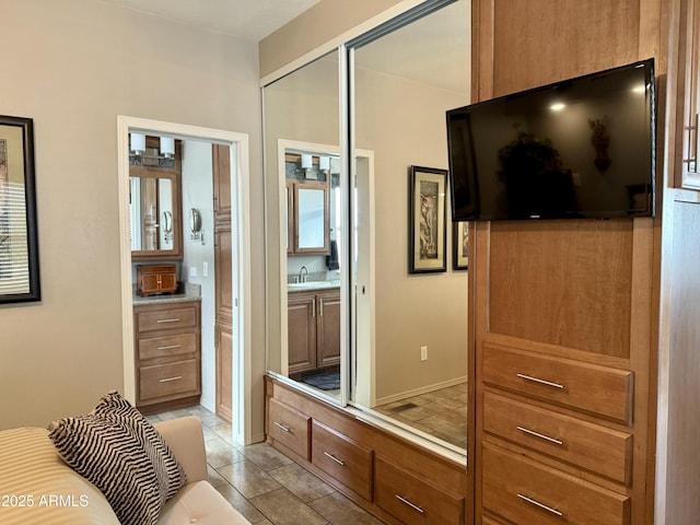 interior space with tile patterned floors and sink