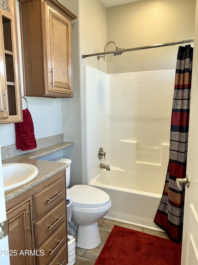 full bathroom featuring toilet, shower / bath combo, vanity, and tile patterned floors