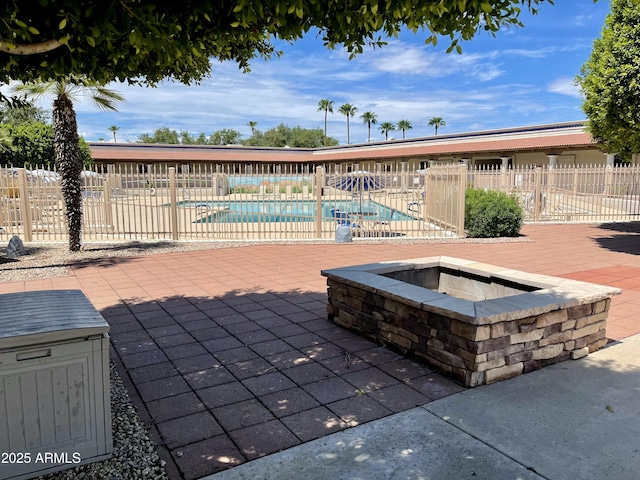 view of swimming pool featuring a patio area