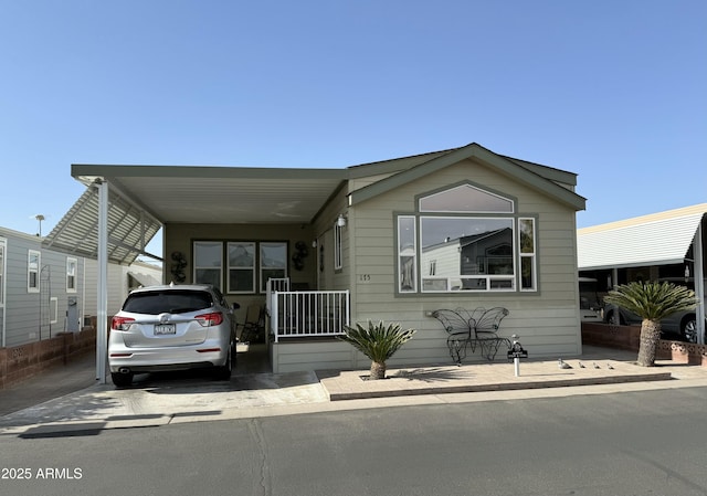 manufactured / mobile home featuring a carport