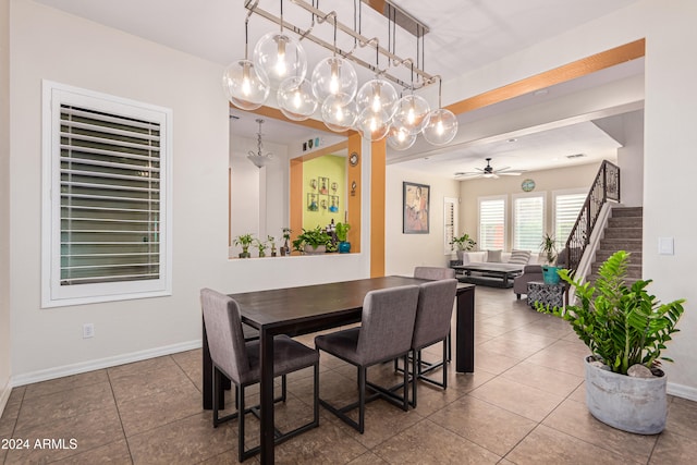 tiled dining area with ceiling fan