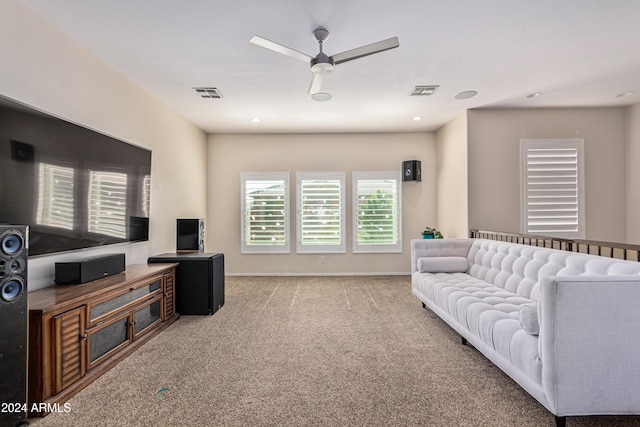 living room with light carpet and ceiling fan