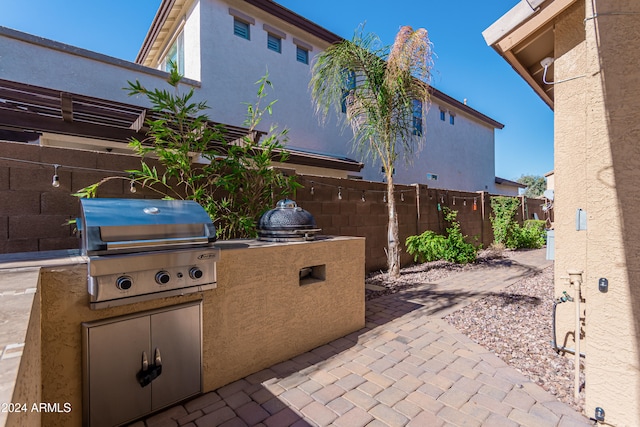 view of patio featuring exterior kitchen and area for grilling