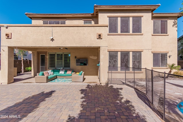 rear view of house featuring outdoor lounge area and a patio