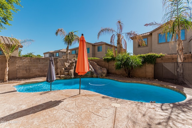 view of swimming pool with a patio area