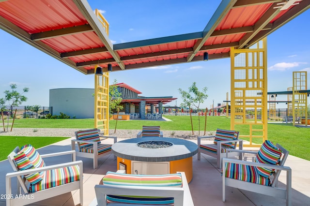 view of patio featuring an outdoor living space with a fire pit