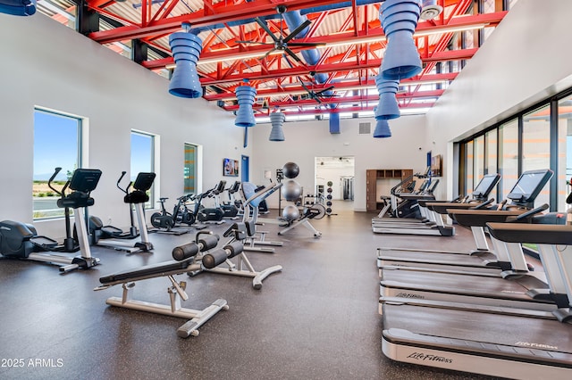 workout area with a high ceiling and visible vents