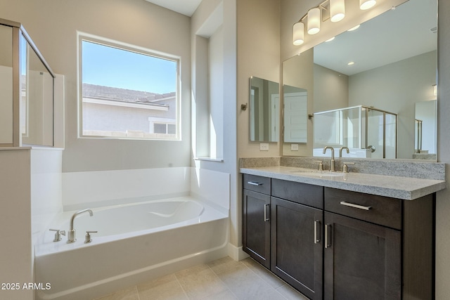 bathroom with shower with separate bathtub, vanity, and tile patterned floors