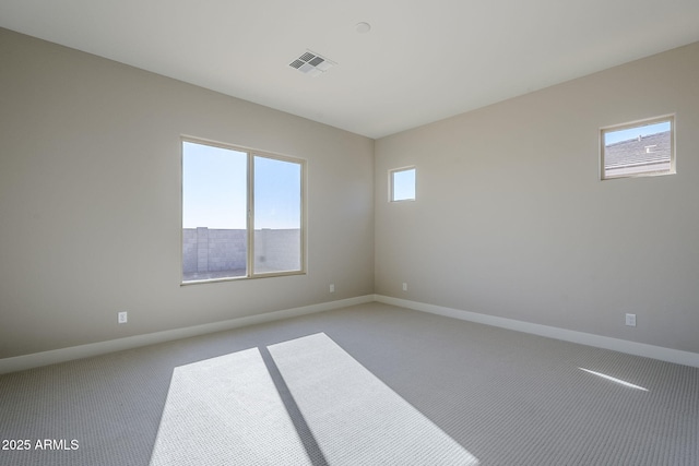 unfurnished room with light colored carpet