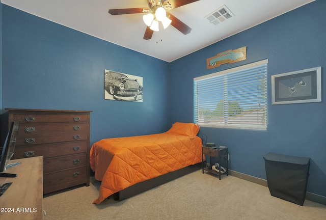 bedroom with light carpet and ceiling fan