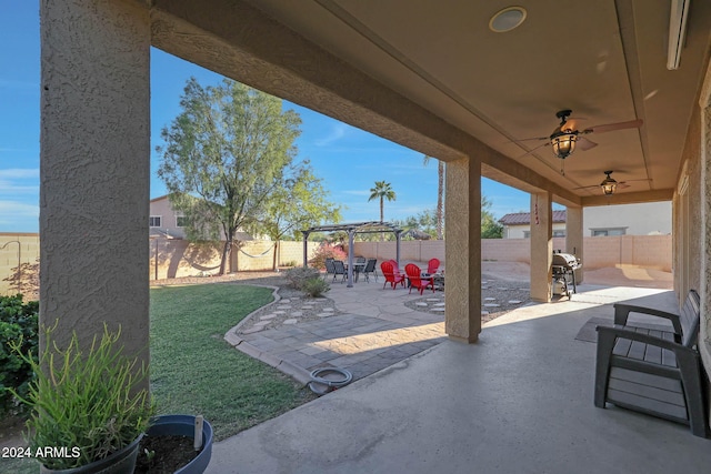 view of patio featuring ceiling fan