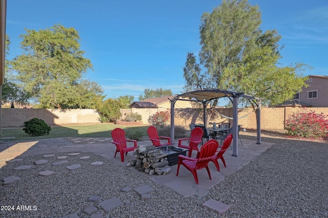 view of patio / terrace featuring an outdoor fire pit