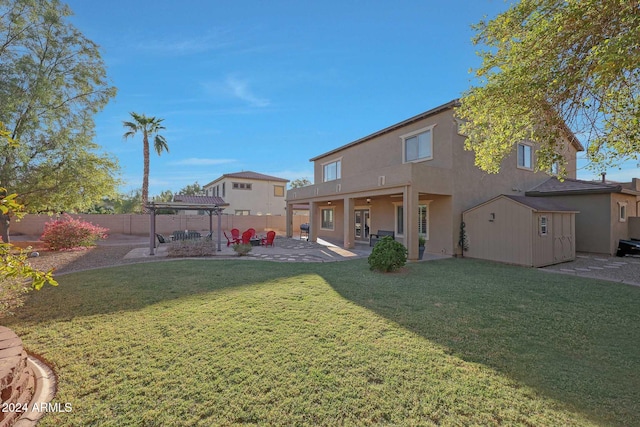 rear view of property featuring a patio area and a lawn