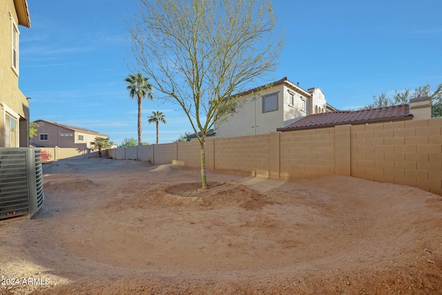 view of yard with central AC unit