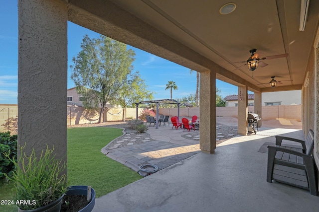 view of patio featuring ceiling fan