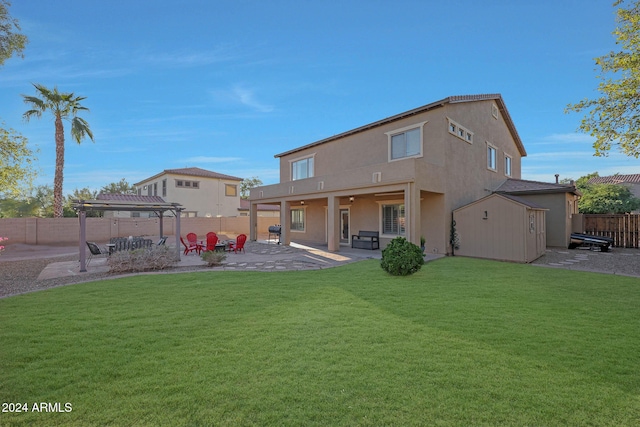 back of property featuring a patio, a pergola, and a yard