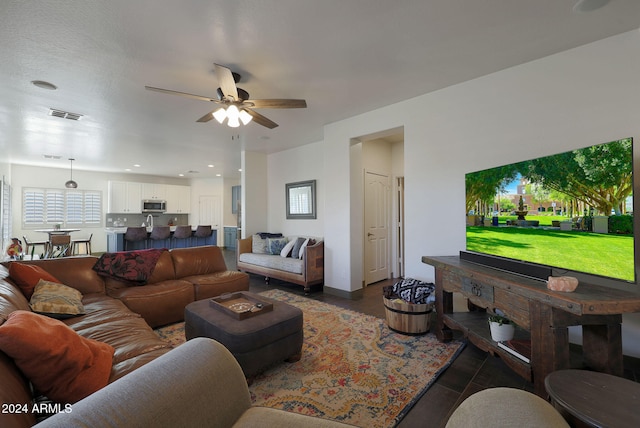 living room with ceiling fan