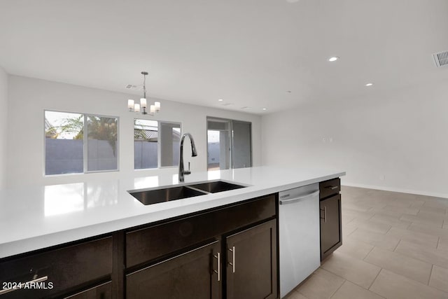 kitchen featuring dark brown cabinetry, sink, hanging light fixtures, stainless steel dishwasher, and a notable chandelier