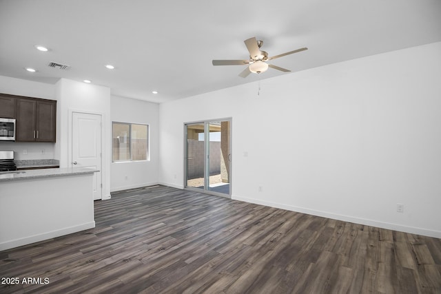 24593 W St Catherine Ave, Buckeye, AZ 85326 - unfurnished living room with a ceiling fan, baseboards, recessed lighting, visible vents, and dark wood-style floors